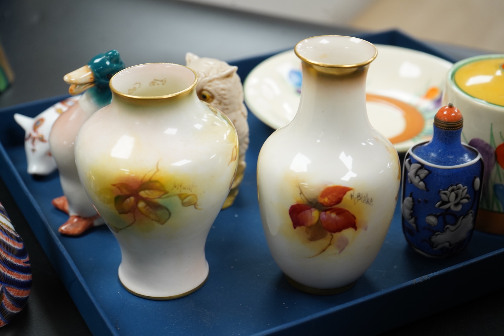 A collection of mixed porcelain and pottery to include four Worcester vases, one signed H. Blake, Clarice Cliff crocus pattern cup, saucer and sugar bowl and two Doulton Imari paperweights, largest 13cm high
